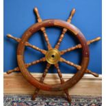A modern decorative ship's wheel, diameter 90cm.