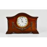 W. BATTY & SONS LTD; an early 20th century mahogany mantel clock, the arched top above the