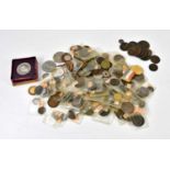 An assortment of late 19th century and later British and World coins, tokens and commemorative