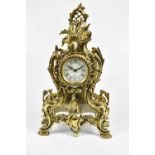 A modern Louis the XV style gilt metal mantle clock, the dial set with Roman numerals, height 49cm.
