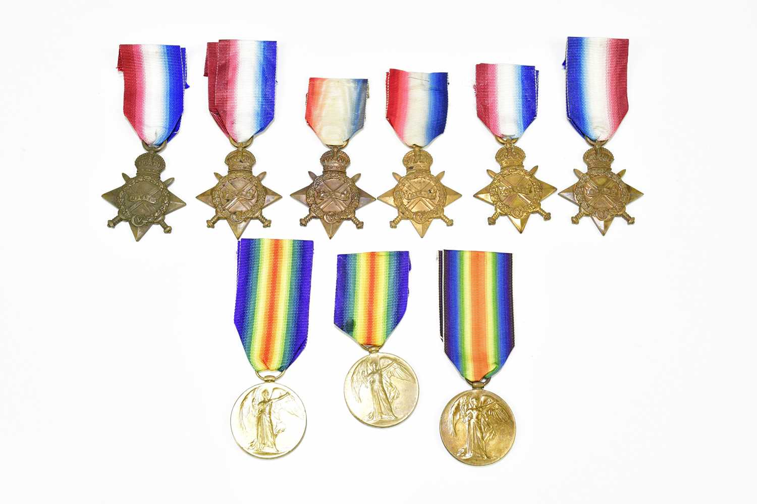 A collection of loose WWI medals comprising six 1914-15 Stars and three Victory Medals, all loose