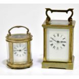 A brass cased carriage clock with white enamel dial set with Roman numerals, 12cm, together with a