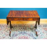 A 19th century mahogany drop-leaf sofa table with two drawers, terminating on brass castors, width