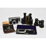 EOTEAD, PARIS; a pair of leather cased binoculars, together with a further pair of binoculars, a