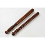 Two vintage policeman's truncheons, length of largest 41cm.