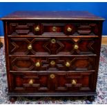 An 18th century oak chest of four long drawers, on bun feet, width 96cm. Condition Report: Height