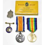 A WWI medal pair comprising War and Victory Medals named to GNR Lomax R.A., in a Dill's tobacco