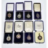 A collection of early 20th century swimming medals to include five hallmarked silver examples,