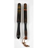 Two 19th century black lacquered truncheons, the first decorated with a crown and inscribed 'GR' and