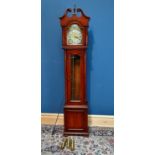 A mahogany effect longcase clock, the dial with applied chapter ring bearing Roman numerals above