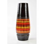 POOLE POTTERY; a large ceramic vase with stylised decoration heightened in orange on a black ground,
