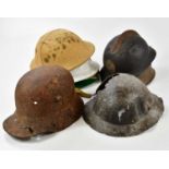Seven various military helmets including a Belgium example, two with heavy deterioration, etc.