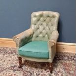 A 19th century leather button back tub chair, on turned column supports terminating on brass