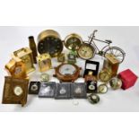 A collection of reproduction brass cased mantel clocks, to include a novelty bicycle clock and