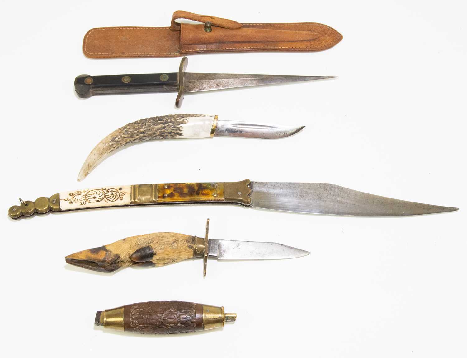 Five knives comprising a folding example with carved handle, a further example with a deer slot