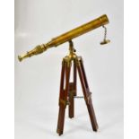 A modern brass telescope on stand, length of telescope 42cm, with pseudo Dolland markings.