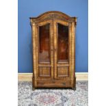 A late 19th century French mahogany bookcase with pair of glazed doors enclosing adjustable shelves,