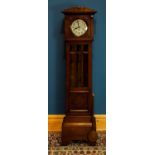 A 1920s oak longcase clock, with silvered dial set with Arabic numerals, height 180cm.