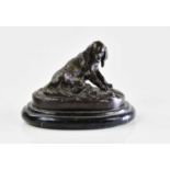 A decorative modern bronze figure of a seated bitch beside puppies, on black marble plinth base,