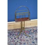 A late Victorian brass and walnut revolving magazine stand, height 77cm.