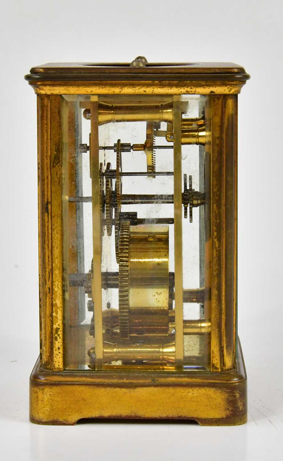 A late 19th century brass cased carriage clock, the enamel dial bearing Arabic and Roman numerals, - Image 4 of 4
