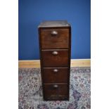 An oak four drawer filing cabinet, height 132cm, depth 72cm, width 46cm.