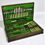 An oak cased canteen of silver plated cutlery.