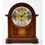 A modern mahogany bracket clock, the silvered dial set with Arabic numerals, height 26cm.