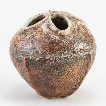 † ALAN WALLWORK (1931-2019); a stoneware seed pod form partially covered in iron staining, incised