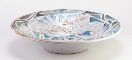 † ANDREW HAZELDEN; a tin glazed earthenware bowl with incised rabbits and painted leaf decoration,