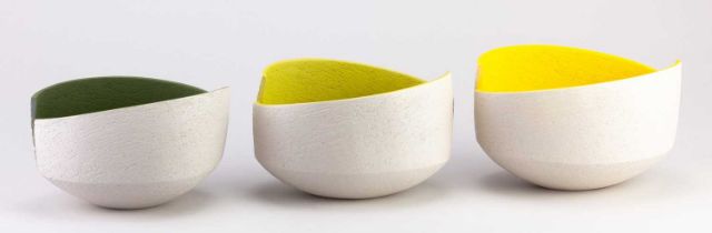 † ASHRAF HANNA (born 1967); a trio of oval cut and altered earthenware bowls with textured pale grey