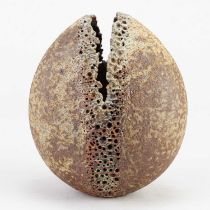 † ALAN WALLWORK (1931-2019); a stoneware split pebble with incised decoration around the parting