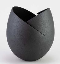 † ASHRAF HANNA (born 1967); a stoneware cut and altered vessel with textured black surface,