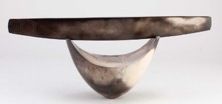 ANTONIA SALMON (born 1959); a smoke fired and burnished stoneware closed boat decorated with incised