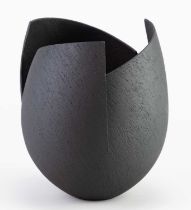 † ASHRAF HANNA (born 1967); a cut and altered earthenware vessel with textured black surface,