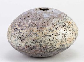 † ALAN WALLWORK (1931-2019); an ovoid stoneware pebble decorated with bands of lilac and white