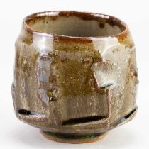 † BEN DODD; a faceted stoneware chawan covered in green ash glaze with kaki highlights, diameter