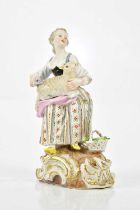 MEISSEN; a 19th century figure representing a girl holding a lamb, blue cross sword mark to