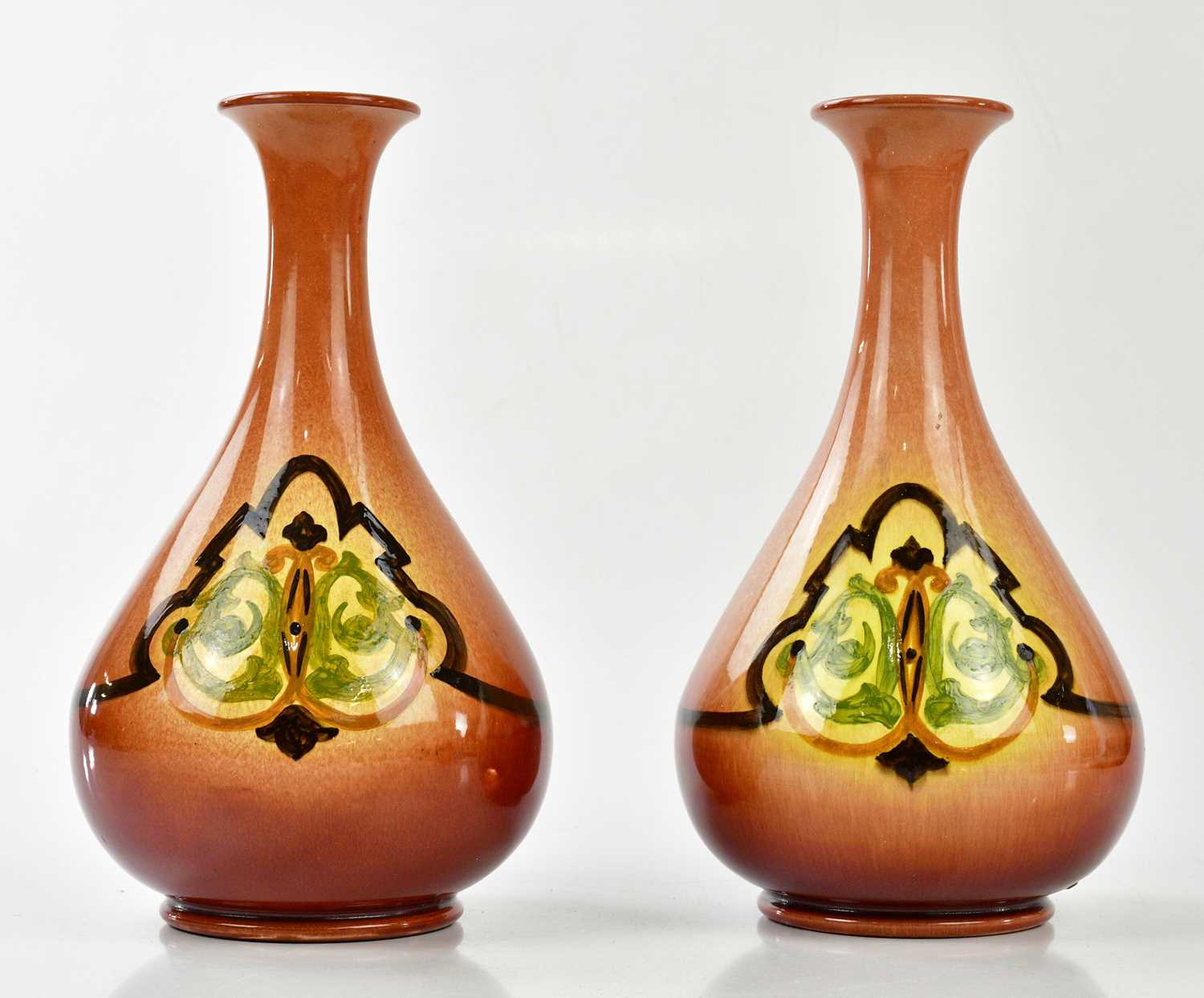 WILLIAM AULT; a pair of Art Pottery vases with stylised designs, impressed signature, height