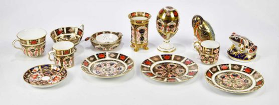 ROYAL CROWN DERBY; a selection of ceramics including trio, egg on stand, a tea strainer and bowl,