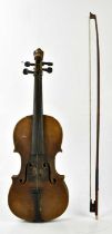 A full size German violin, Stradivarius copy, with lion carved scroll, the two-piece back length