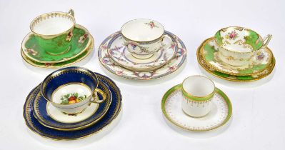 ROYAL WORCESTER; a hand painted and gilt decorated trio, an Aynsley trio decorated with fruit, a