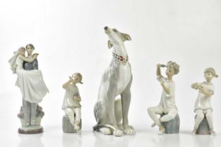 LLADRO; four figures including a married couple entering the threshold, height 28cm with a large