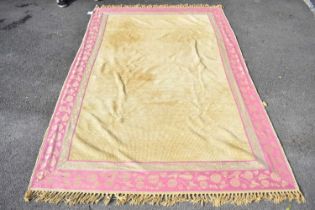 LAURA ASHLEY; a mustard yellow ground rug, with pink border, 230 x 158cm.