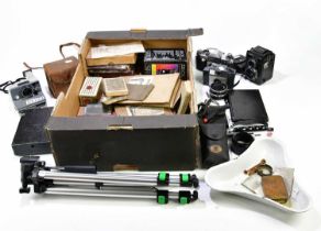 A collection of cameras and accessories, to include a Practica PL Noval, a plate camera, a Boxed