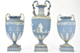 WEDGWOOD; a trio of 19th century twin handled pedestal vases, the larger vase with trailing serpents