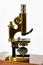 A cased lacquered brass monocular microscope, signed C. Reichert, Wien, numbered 11563, set with
