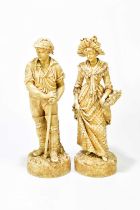 A pair of late 19th century Continental figures representing a farmhand and a maiden wearing a