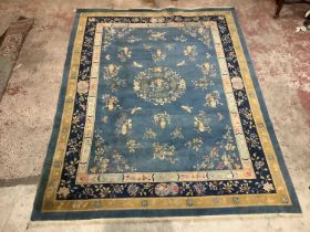 A blue ground Chinese carpet. 356x271cm