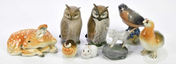 ROYAL COPENHAGEN; four models of birds, including two owls and a lamb on a rock, also four Russian